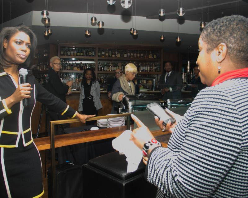 Trump aide Omarosa Manigault (left) listens to a question from reporter Hazel Trice Edney. (Shevry Lassiter)